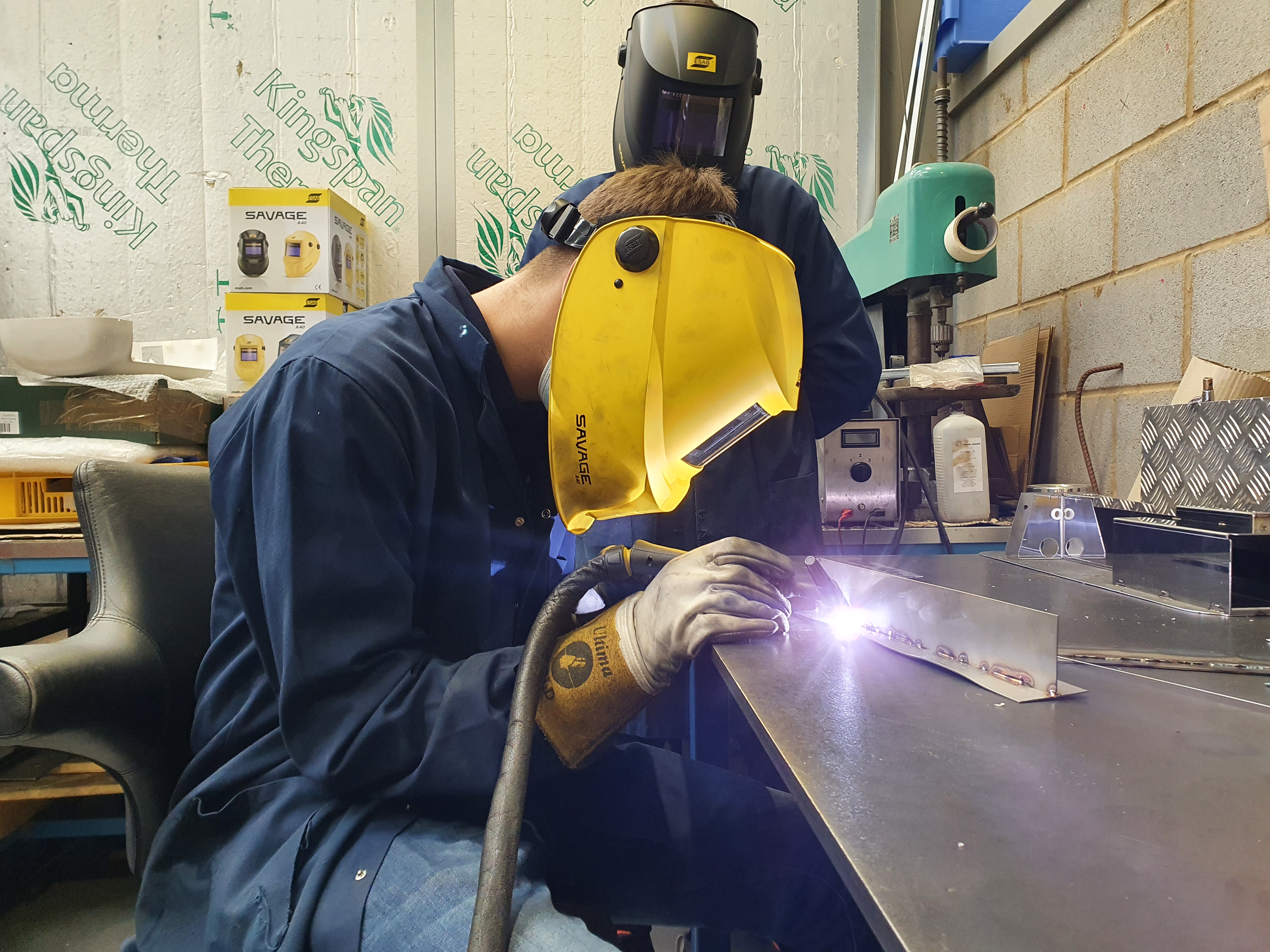 Apprentice welding metal